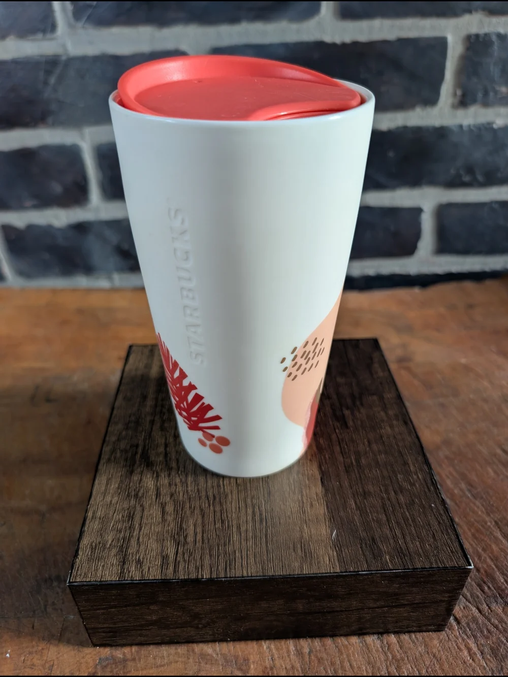Starbucks White Ceramic Travel Mug with Coral Lid and Pinecone Accent